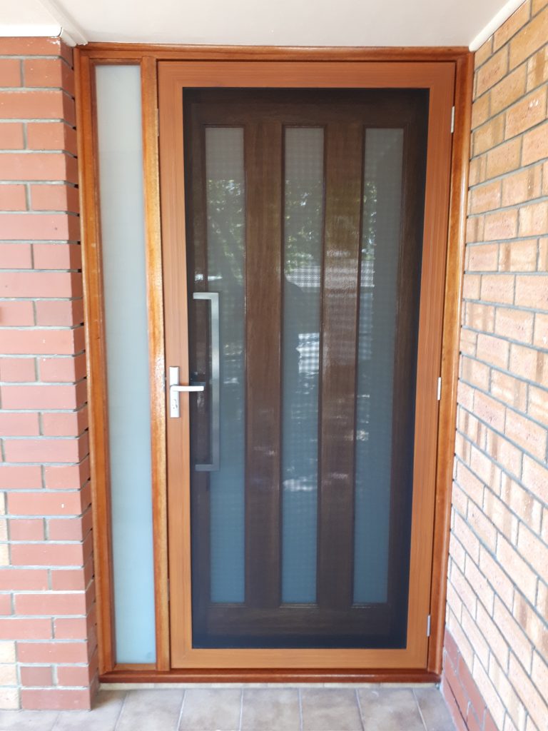 After - Security door replacement with wooden and glass inserts and security screen